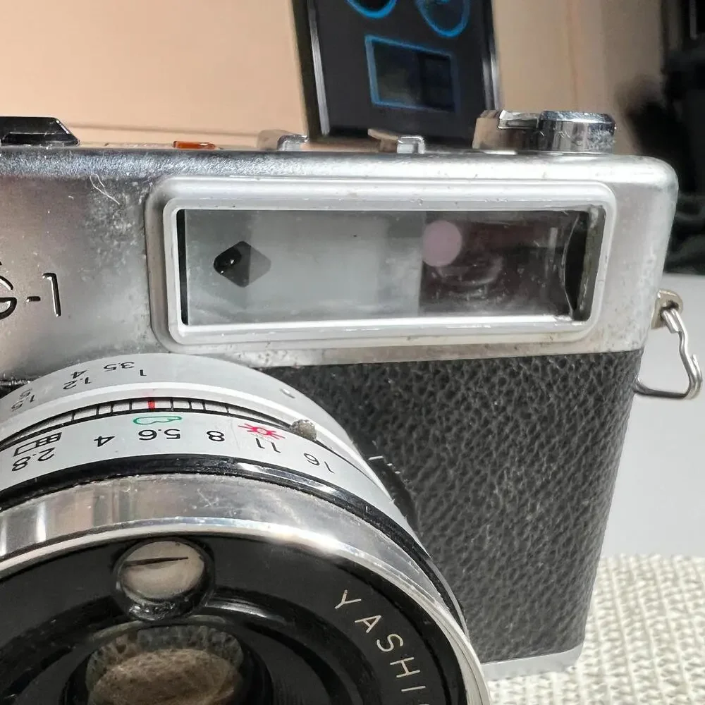 Yashica MG-1 35mm Rangefinder Film Camera 45mm f/2.8 Lens Made‎ in Hong Kong Cap